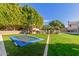 Expansive backyard with trampoline and playset, ideal for  at 3210 E Brookwood Ct, Phoenix, AZ 85048