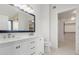 Modern bathroom with double vanity, large mirror, and walk-in closet at 3210 E Brookwood Ct, Phoenix, AZ 85048