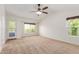 Bright bedroom with neutral carpeting and patio access at 3210 E Brookwood Ct, Phoenix, AZ 85048