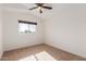 Simple bedroom with neutral walls and ceiling fan at 3210 E Brookwood Ct, Phoenix, AZ 85048