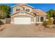 Two-story house with a two-car garage and well-maintained landscaping at 3210 E Brookwood Ct, Phoenix, AZ 85048