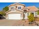 Two-story house with a two-car garage and well-maintained landscaping at 3210 E Brookwood Ct, Phoenix, AZ 85048