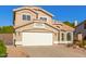 Two-story house with a two-car garage and well-maintained landscaping at 3210 E Brookwood Ct, Phoenix, AZ 85048