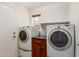 Laundry room with washer, dryer, and cabinets at 3210 E Brookwood Ct, Phoenix, AZ 85048