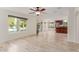 Living area with tile floors, ceiling fan, and pool view at 3210 E Brookwood Ct, Phoenix, AZ 85048