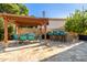 Outdoor dining area with pergola, seating, and bar at 3210 E Brookwood Ct, Phoenix, AZ 85048