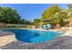 Relaxing freeform pool with spacious patio and lush landscaping at 3210 E Brookwood Ct, Phoenix, AZ 85048