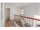 Upstairs hallway with a built-in storage unit and stairs at 3210 E Brookwood Ct, Phoenix, AZ 85048