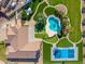 Aerial view of house, pool, and expansive backyard with sports court at 356 W Ivanhoe St, Gilbert, AZ 85233