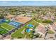 Aerial view of property with pool, sports courts, and surrounding neighborhood at 356 W Ivanhoe St, Gilbert, AZ 85233