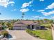 Single story home with tile roof, two car garage, and landscaped yard at 356 W Ivanhoe St, Gilbert, AZ 85233