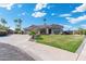 House exterior featuring a manicured lawn and palm trees at 356 W Ivanhoe St, Gilbert, AZ 85233