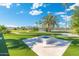 Modern fire pit area with a manicured lawn at 356 W Ivanhoe St, Gilbert, AZ 85233