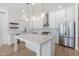 Modern kitchen with white cabinets, quartz countertops and stainless steel appliances at 356 W Ivanhoe St, Gilbert, AZ 85233