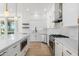 Modern kitchen with white cabinets, a large island, and stainless steel appliances at 356 W Ivanhoe St, Gilbert, AZ 85233