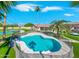 Stunning pool with a large backyard and palm trees at 356 W Ivanhoe St, Gilbert, AZ 85233