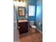 Small bathroom with teal walls, a toilet, and a vanity at 35706 W Costa Blanca Dr, Maricopa, AZ 85138