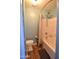 Bathroom with shower/tub combo and updated flooring at 35706 W Costa Blanca Dr, Maricopa, AZ 85138