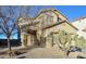 Two-story house with desert landscaping and a two-car garage at 35706 W Costa Blanca Dr, Maricopa, AZ 85138