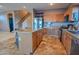 Spacious kitchen featuring an island, stainless steel appliances, and wood cabinets at 35706 W Costa Blanca Dr, Maricopa, AZ 85138