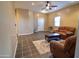 Living room with two brown leather recliners and a coffee table at 35706 W Costa Blanca Dr, Maricopa, AZ 85138