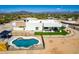 Aerial view of a house with a kidney-shaped pool and fenced backyard at 36627 N 18Th Dr, Phoenix, AZ 85086