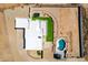 Aerial view of a house with a pool and a small grassy backyard at 36627 N 18Th Dr, Phoenix, AZ 85086