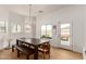 Bright dining area with table and bench seating, near kitchen at 36627 N 18Th Dr, Phoenix, AZ 85086