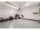 Garage with epoxy flooring and plenty of room for storage at 36627 N 18Th Dr, Phoenix, AZ 85086