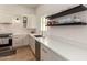 Modern kitchen with white cabinets and quartz countertops at 36627 N 18Th Dr, Phoenix, AZ 85086