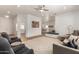 Open living room with modern design and view into the kitchen at 36627 N 18Th Dr, Phoenix, AZ 85086