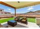 Covered patio with wicker furniture and mountain views at 36627 N 18Th Dr, Phoenix, AZ 85086