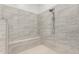 Large walk-in shower with tiled walls and built-in seat at 36627 N 18Th Dr, Phoenix, AZ 85086