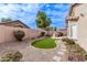 Spacious backyard featuring desert landscaping, artificial turf and a built-in BBQ at 3711 E Sandy Way, Gilbert, AZ 85297