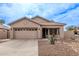 Charming single-story home featuring a two-car garage and desert landscaping at 3711 E Sandy Way, Gilbert, AZ 85297