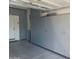 Spacious garage features custom gray cabinets for ample storage and organization at 3711 E Sandy Way, Gilbert, AZ 85297