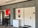 Organized garage with storage cabinets, water heater, and utility area; maximizing space at 3711 E Sandy Way, Gilbert, AZ 85297