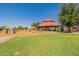 Community park showcasing the lush greenery and playground with shaded picnic area for relaxation at 3711 E Sandy Way, Gilbert, AZ 85297