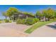 Exterior view of park restroom including shrubs, gravel, walkway and blue sky at 3711 E Sandy Way, Gilbert, AZ 85297