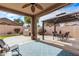 Relaxing covered patio boasts a gazebo, built-in BBQ, and comfortable seating area at 3711 E Sandy Way, Gilbert, AZ 85297