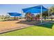 Bright and colorful playground with slides, climbing structures, and ample shade for safe outdoor fun at 3711 E Sandy Way, Gilbert, AZ 85297