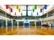 Indoor basketball court with bleachers and high ceilings at 41705 N Globe Ct, Phoenix, AZ 85086