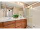 Double vanity bathroom with a walk-in shower at 41705 N Globe Ct, Phoenix, AZ 85086