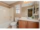 Bathroom with tub, toilet and wood vanity at 41705 N Globe Ct, Phoenix, AZ 85086