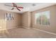 Bedroom with ceiling fan and guitar wall art at 41705 N Globe Ct, Phoenix, AZ 85086