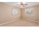 Bedroom with ceiling fan and floral wall art at 41705 N Globe Ct, Phoenix, AZ 85086