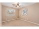 Bright bedroom with ceiling fan and neutral wall colors at 41705 N Globe Ct, Phoenix, AZ 85086