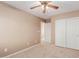 Well-lit bedroom with double door closet and neutral walls at 41705 N Globe Ct, Phoenix, AZ 85086