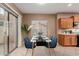 Kitchen dining area with a table and chairs, and patio access at 41705 N Globe Ct, Phoenix, AZ 85086