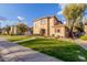 Two-story tan house with a landscaped lawn and walkway at 41705 N Globe Ct, Phoenix, AZ 85086